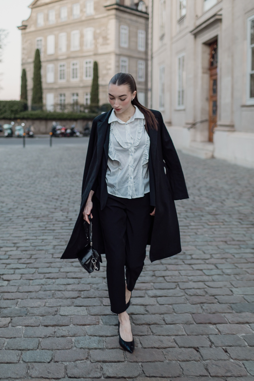Model walking at sunrise in Geneva’s Old Town
