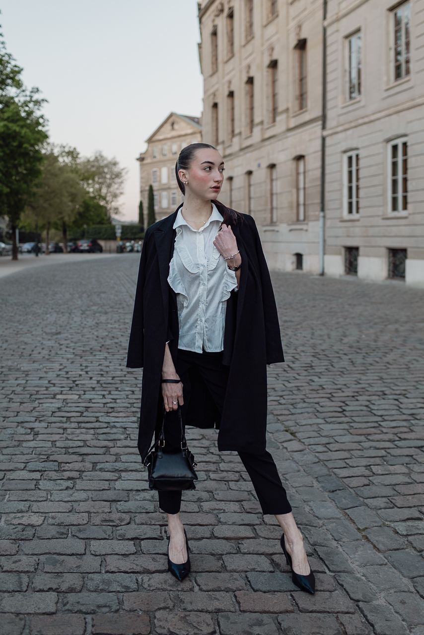 Model standing still at sunrise in Geneva’s Old Town