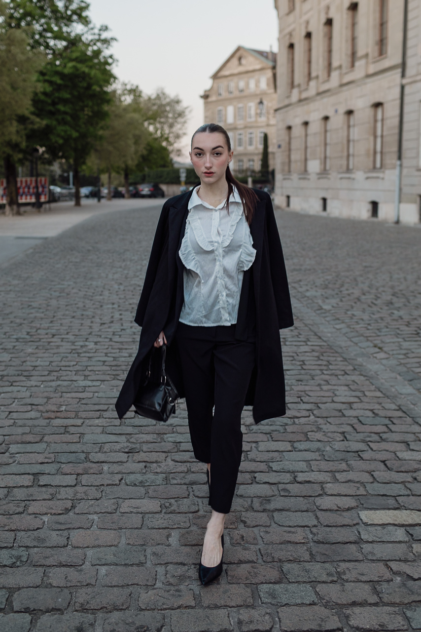 Model walking dynamically at sunrise in Geneva’s Old Town
